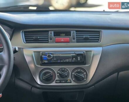 Червоний Міцубісі Lancer, об'ємом двигуна 1.58 л та пробігом 223 тис. км за 6400 $, фото 16 на Automoto.ua