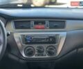 Червоний Міцубісі Lancer, об'ємом двигуна 1.58 л та пробігом 223 тис. км за 6400 $, фото 16 на Automoto.ua