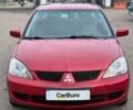 Червоний Міцубісі Lancer, об'ємом двигуна 1.58 л та пробігом 223 тис. км за 6400 $, фото 5 на Automoto.ua