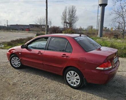 Червоний Міцубісі Lancer, об'ємом двигуна 1.6 л та пробігом 220 тис. км за 5800 $, фото 5 на Automoto.ua