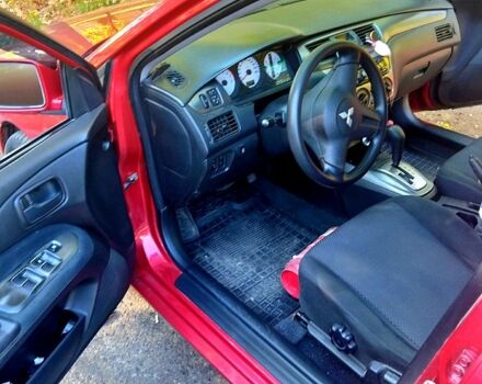 Красный Мицубиси Лансер, объемом двигателя 1.6 л и пробегом 144 тыс. км за 6000 $, фото 4 на Automoto.ua