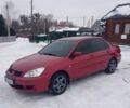 Красный Мицубиси Лансер, объемом двигателя 1.6 л и пробегом 277 тыс. км за 4400 $, фото 1 на Automoto.ua