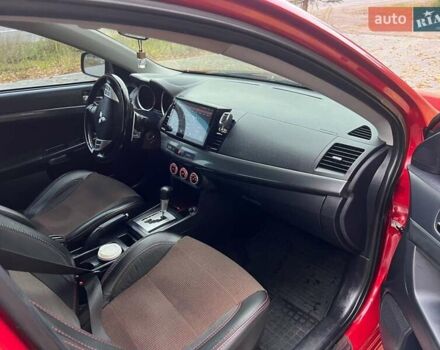 Красный Мицубиси Лансер, объемом двигателя 2 л и пробегом 197 тыс. км за 6500 $, фото 10 на Automoto.ua