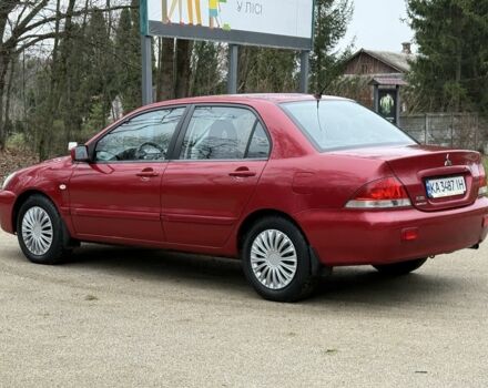 Червоний Міцубісі Lancer, об'ємом двигуна 1.6 л та пробігом 220 тис. км за 4600 $, фото 4 на Automoto.ua