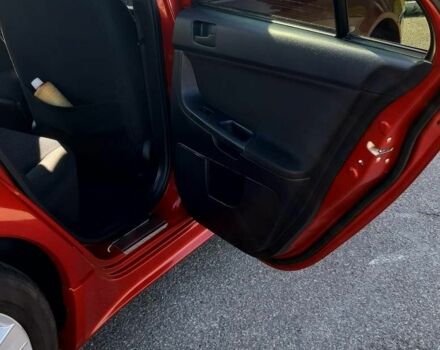 Красный Мицубиси Лансер, объемом двигателя 2 л и пробегом 110 тыс. км за 7500 $, фото 21 на Automoto.ua