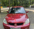Червоний Міцубісі Lancer, об'ємом двигуна 1.6 л та пробігом 270 тис. км за 5699 $, фото 3 на Automoto.ua