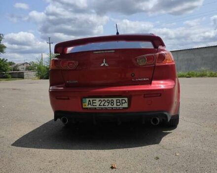 Червоний Міцубісі Lancer, об'ємом двигуна 2 л та пробігом 301 тис. км за 6200 $, фото 1 на Automoto.ua