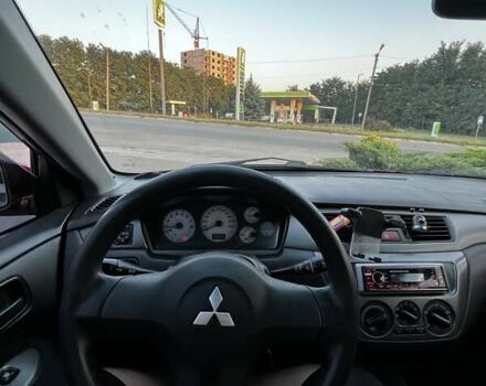 Червоний Міцубісі Lancer, об'ємом двигуна 1.6 л та пробігом 257 тис. км за 4600 $, фото 6 на Automoto.ua