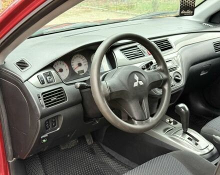 Червоний Міцубісі Lancer, об'ємом двигуна 1.6 л та пробігом 220 тис. км за 4600 $, фото 13 на Automoto.ua