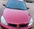 Червоний Міцубісі Lancer, об'ємом двигуна 1.6 л та пробігом 227 тис. км за 5300 $, фото 1 на Automoto.ua