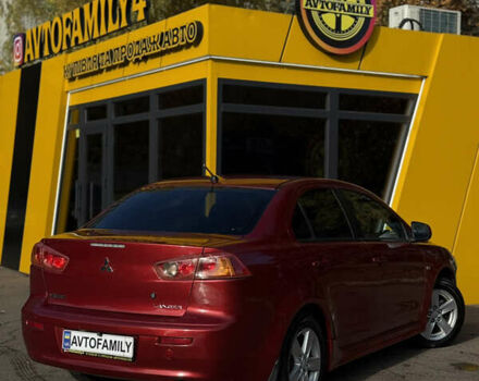 Червоний Міцубісі Lancer, об'ємом двигуна 2 л та пробігом 215 тис. км за 6500 $, фото 4 на Automoto.ua