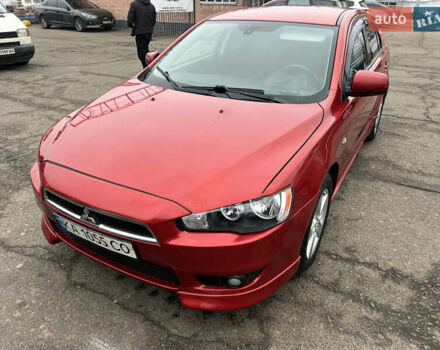 Красный Мицубиси Лансер, объемом двигателя 2 л и пробегом 330 тыс. км за 5250 $, фото 12 на Automoto.ua