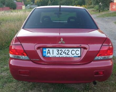 Красный Мицубиси Лансер, объемом двигателя 1.58 л и пробегом 198 тыс. км за 4650 $, фото 2 на Automoto.ua