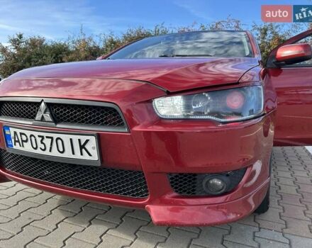 Красный Мицубиси Лансер, объемом двигателя 2 л и пробегом 227 тыс. км за 7000 $, фото 8 на Automoto.ua