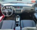 Червоний Міцубісі Lancer, об'ємом двигуна 1.58 л та пробігом 223 тис. км за 6400 $, фото 17 на Automoto.ua