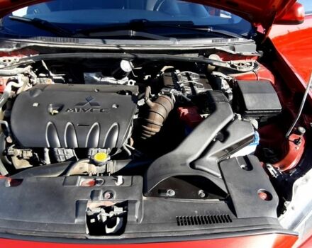 Красный Мицубиси Лансер, объемом двигателя 2 л и пробегом 110 тыс. км за 7500 $, фото 10 на Automoto.ua