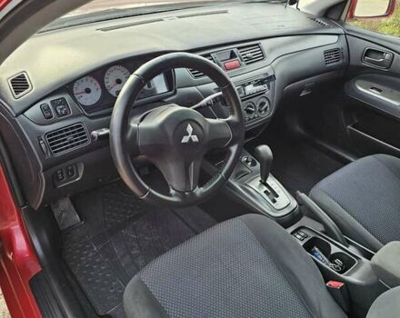 Червоний Міцубісі Lancer, об'ємом двигуна 1.6 л та пробігом 220 тис. км за 5800 $, фото 7 на Automoto.ua
