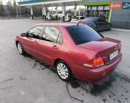 Червоний Міцубісі Lancer, об'ємом двигуна 1.58 л та пробігом 140 тис. км за 6000 $, фото 17 на Automoto.ua