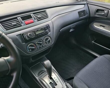 Червоний Міцубісі Lancer, об'ємом двигуна 1.6 л та пробігом 220 тис. км за 5800 $, фото 10 на Automoto.ua