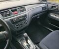 Червоний Міцубісі Lancer, об'ємом двигуна 1.6 л та пробігом 220 тис. км за 5800 $, фото 10 на Automoto.ua