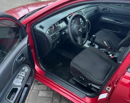 Красный Мицубиси Лансер, объемом двигателя 1.6 л и пробегом 265 тыс. км за 2956 $, фото 5 на Automoto.ua