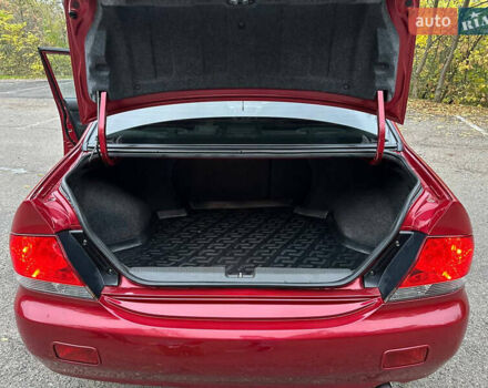 Красный Мицубиси Лансер, объемом двигателя 1.6 л и пробегом 192 тыс. км за 5999 $, фото 3 на Automoto.ua