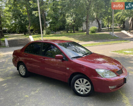 Червоний Міцубісі Lancer, об'ємом двигуна 1.6 л та пробігом 270 тис. км за 5699 $, фото 2 на Automoto.ua