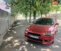 Красный Мицубиси Лансер, объемом двигателя 2 л и пробегом 174 тыс. км за 7150 $, фото 1 на Automoto.ua