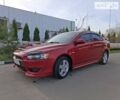 Червоний Міцубісі Lancer, об'ємом двигуна 2 л та пробігом 223 тис. км за 6950 $, фото 1 на Automoto.ua