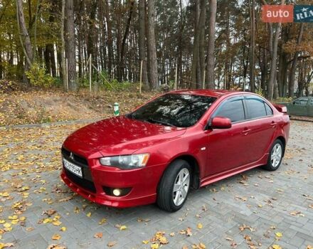 Красный Мицубиси Лансер, объемом двигателя 2 л и пробегом 197 тыс. км за 6500 $, фото 5 на Automoto.ua