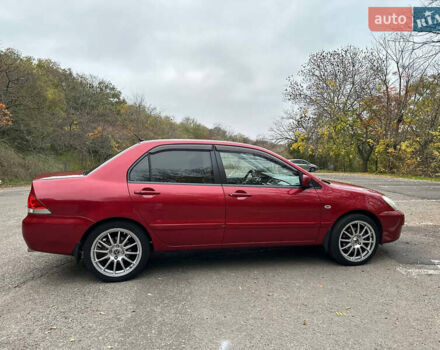 Красный Мицубиси Лансер, объемом двигателя 1.6 л и пробегом 192 тыс. км за 5999 $, фото 6 на Automoto.ua