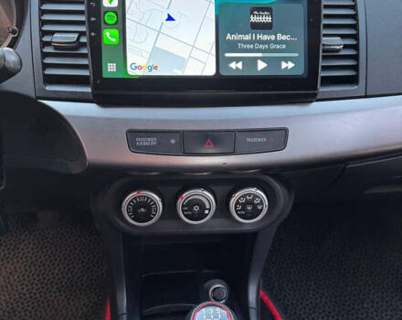 Красный Мицубиси Лансер, объемом двигателя 2 л и пробегом 143 тыс. км за 5200 $, фото 20 на Automoto.ua