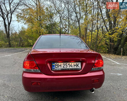 Красный Мицубиси Лансер, объемом двигателя 1.6 л и пробегом 192 тыс. км за 5999 $, фото 2 на Automoto.ua