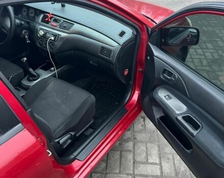 Красный Мицубиси Лансер, объемом двигателя 1.6 л и пробегом 265 тыс. км за 2956 $, фото 8 на Automoto.ua