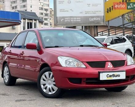 Червоний Міцубісі Lancer, об'ємом двигуна 1.58 л та пробігом 223 тис. км за 6400 $, фото 1 на Automoto.ua