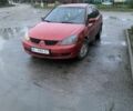 Красный Мицубиси Лансер, объемом двигателя 1.6 л и пробегом 230 тыс. км за 3000 $, фото 1 на Automoto.ua