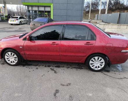 Червоний Міцубісі Lancer, об'ємом двигуна 1.6 л та пробігом 140 тис. км за 6000 $, фото 5 на Automoto.ua