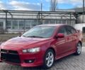 Червоний Міцубісі Lancer, об'ємом двигуна 1.8 л та пробігом 189 тис. км за 8990 $, фото 1 на Automoto.ua