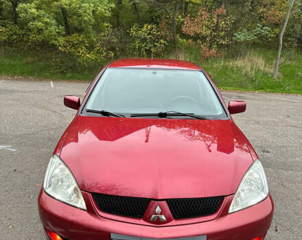 Красный Мицубиси Лансер, объемом двигателя 1.6 л и пробегом 192 тыс. км за 5999 $, фото 5 на Automoto.ua