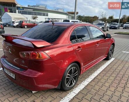Красный Мицубиси Лансер, объемом двигателя 2 л и пробегом 227 тыс. км за 7000 $, фото 5 на Automoto.ua