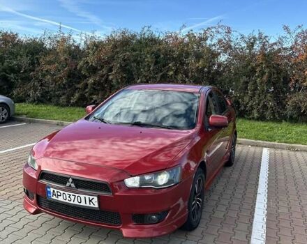 Красный Мицубиси Лансер, объемом двигателя 2 л и пробегом 227 тыс. км за 7000 $, фото 1 на Automoto.ua