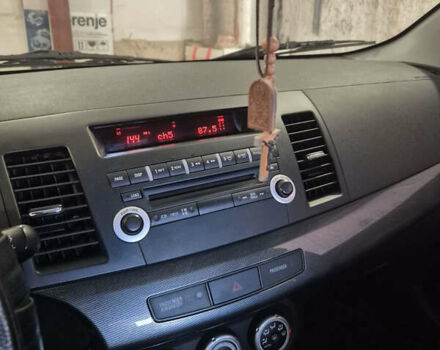 Красный Мицубиси Лансер, объемом двигателя 2 л и пробегом 65 тыс. км за 9300 $, фото 19 на Automoto.ua