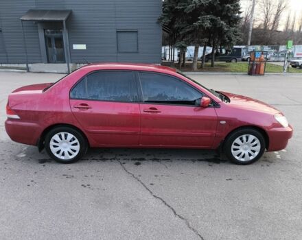 Червоний Міцубісі Lancer, об'ємом двигуна 1.6 л та пробігом 140 тис. км за 6000 $, фото 3 на Automoto.ua