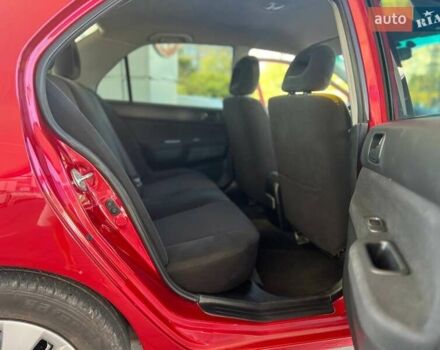 Червоний Міцубісі Lancer, об'ємом двигуна 1.58 л та пробігом 223 тис. км за 6400 $, фото 14 на Automoto.ua