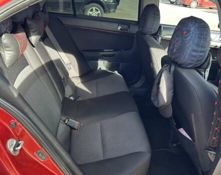 Красный Мицубиси Лансер, объемом двигателя 2 л и пробегом 227 тыс. км за 7000 $, фото 12 на Automoto.ua