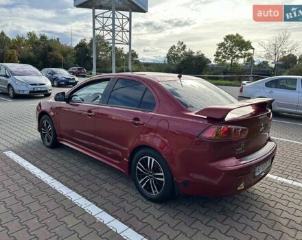 Красный Мицубиси Лансер, объемом двигателя 2 л и пробегом 227 тыс. км за 7000 $, фото 4 на Automoto.ua