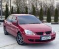 Красный Мицубиси Лансер, объемом двигателя 1.6 л и пробегом 276 тыс. км за 4550 $, фото 1 на Automoto.ua