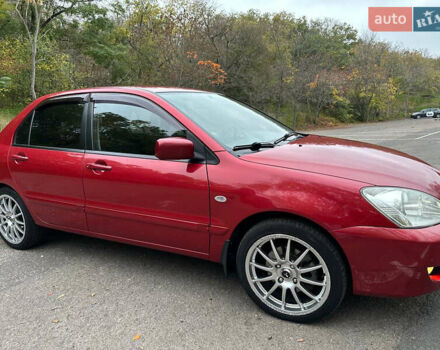 Красный Мицубиси Лансер, объемом двигателя 1.6 л и пробегом 192 тыс. км за 5999 $, фото 7 на Automoto.ua