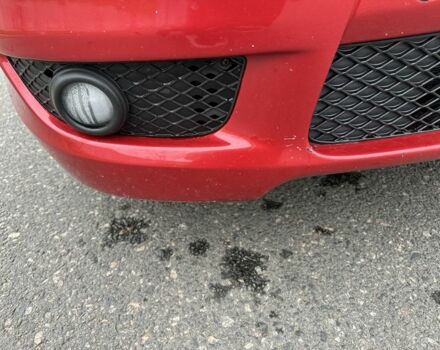 Красный Мицубиси Лансер, объемом двигателя 2 л и пробегом 366 тыс. км за 6500 $, фото 18 на Automoto.ua