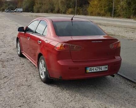 Червоний Міцубісі Lancer, об'ємом двигуна 2 л та пробігом 217 тис. км за 7100 $, фото 3 на Automoto.ua